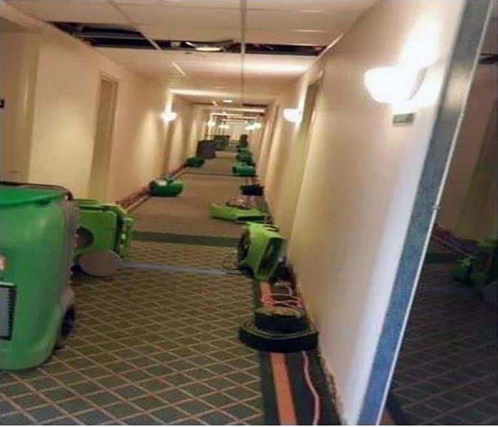 flood cleaned up in hotel hallway